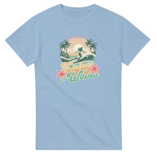 Light blue Tropical Surf graphic tee with palm trees, surfer on a wave, retro sunset and hibiscus, Enjoy The Waves.