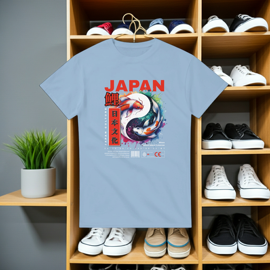 Light blue t-shirt with Japanese design on a wooden shelf with shoes and plants.