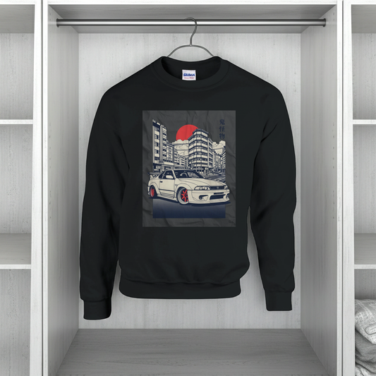 Black sweatshirt with a car and building graphic on a hanger in a closet.