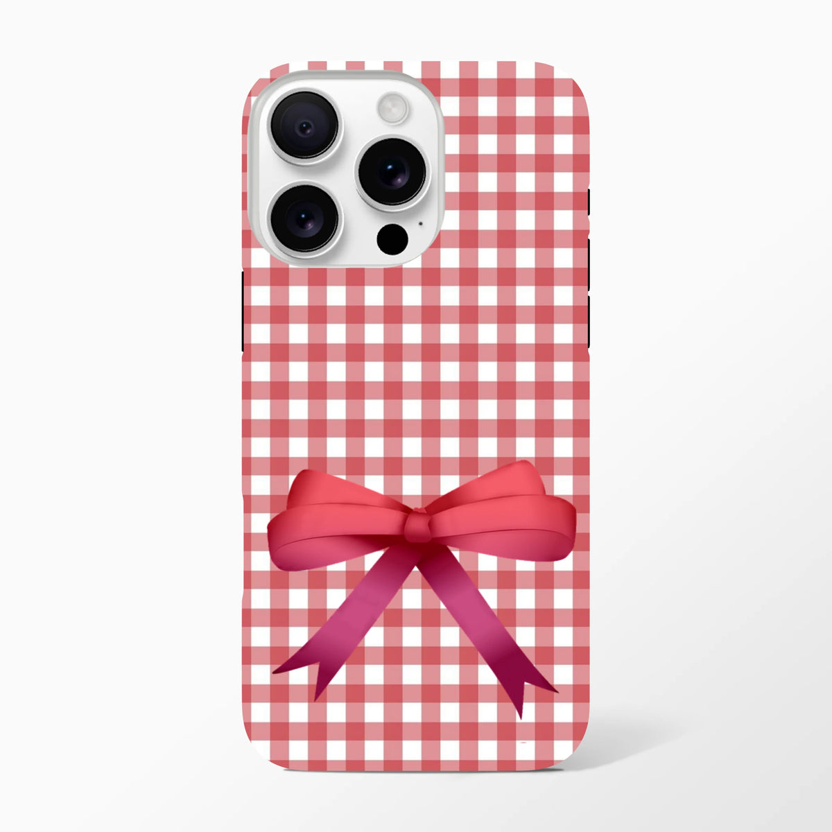 Red gingham iPhone case featuring a large pink bow. Cute coquette aesthetic tough phone cover for iOS 13-16 devices.