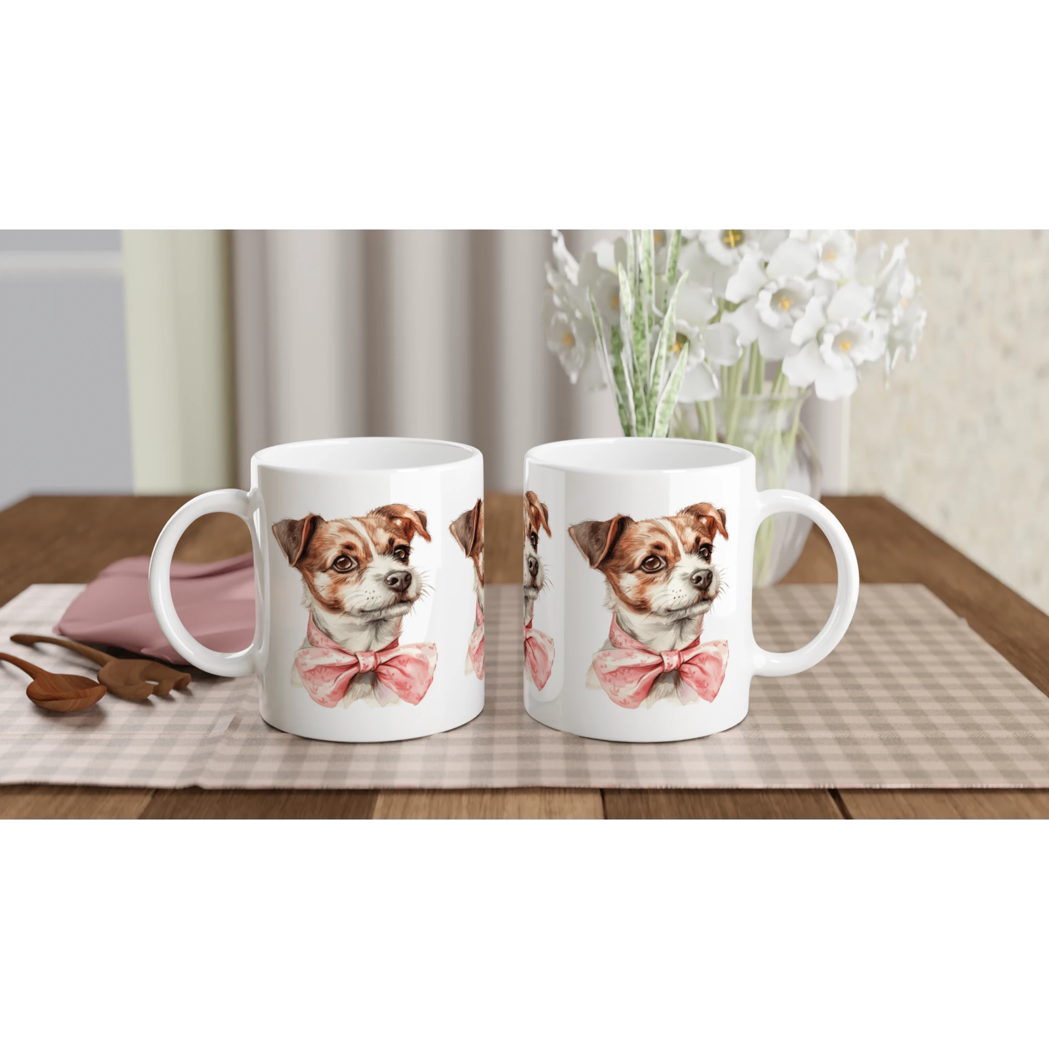 Pair of white ceramic mugs featuring a cute dog with a pink bow tie on a checkered table mat.