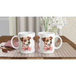 Pair of white ceramic mugs featuring a cute dog with a pink bow tie on a checkered table mat.