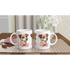 Pair of white ceramic mugs featuring a cute dog with a pink bow tie on a checkered table mat.