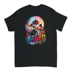 Back of black T-shirt featuring a colorful "Tucked" graphic with a lowered car, Urban Palm Trees text, and sunset art.