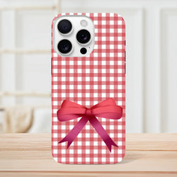 Red gingham iPhone case featuring a large 3D pink bow print. Cute coquette tough cover for iOS 13-16 devices.