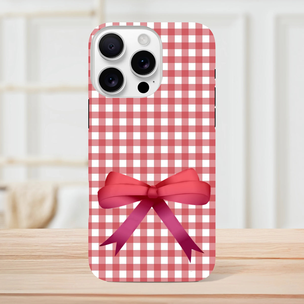 Red gingham iPhone case featuring a large 3D pink bow print. Cute coquette tough cover for iOS 13-16 devices.