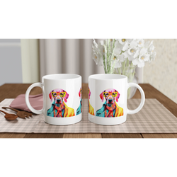 Two white ceramic mugs feature vibrant dog portraits wearing glasses on a plaid placemat.