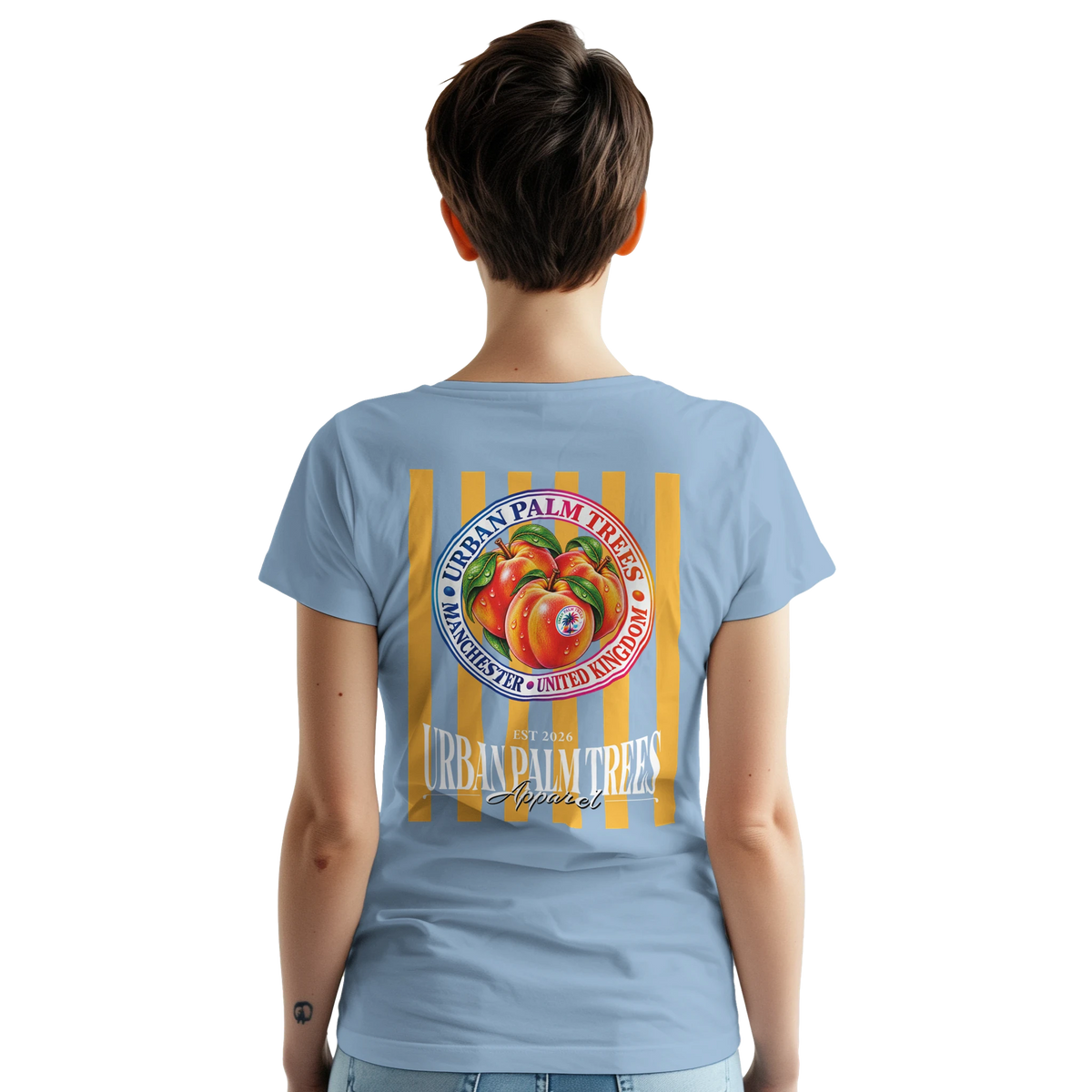 Back view of women's light blue retro t-shirt featuring striped fruit back print with vintage peach graphic and Urban Palm Trees typography.