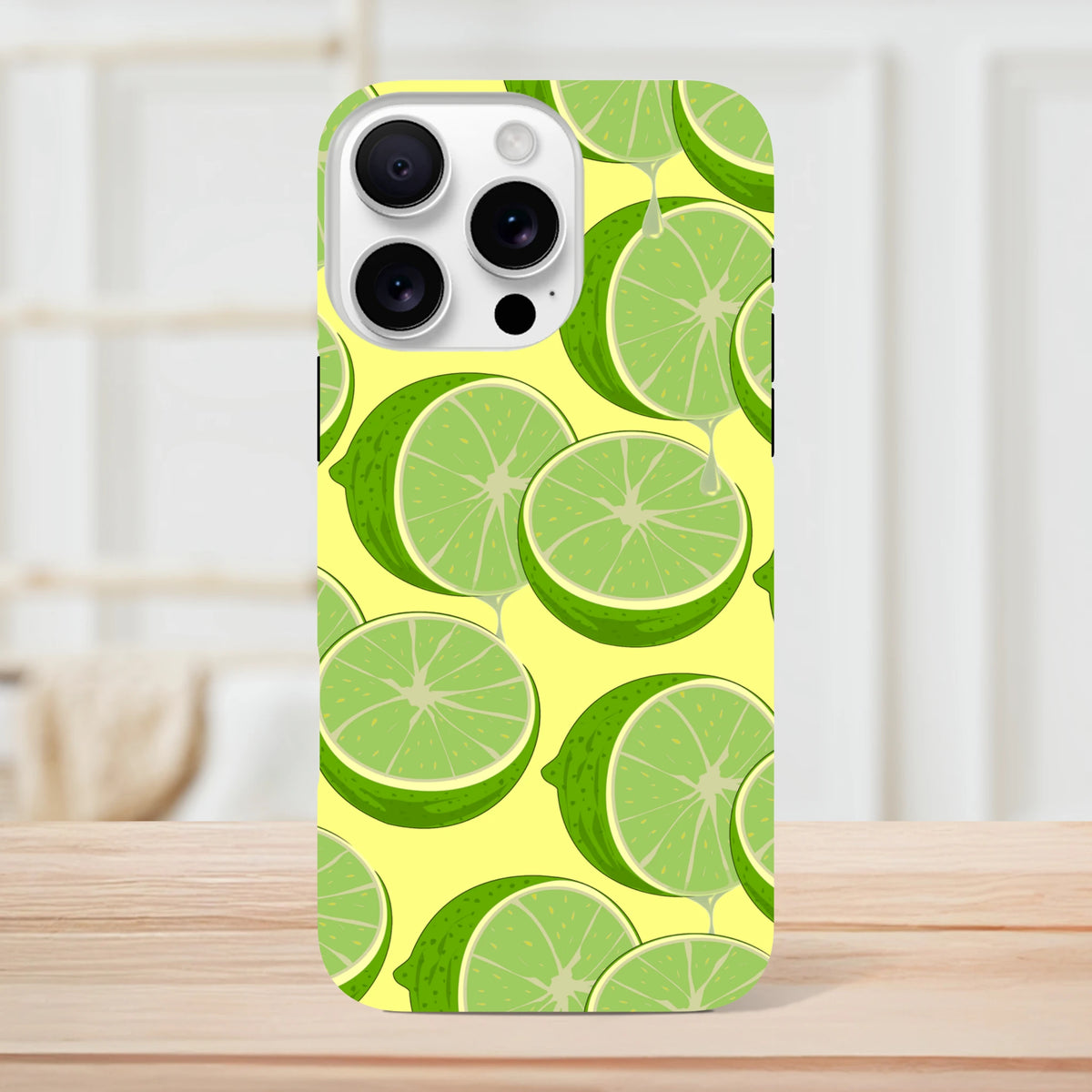 Fresh green lime slice pattern Tough iPhone case for 13-16 models. Durable citrus phone cover protecting device with vibrant streetwear style.
