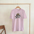 Pink women's You Matter slogan graphic tee with floral accent, soft cotton blend, relaxed fit on hanger.