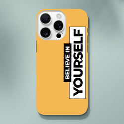 Orange iPhone case with vertical black and white "Believe In Yourself" slogan print. Tough phone cover for daily carry protection.