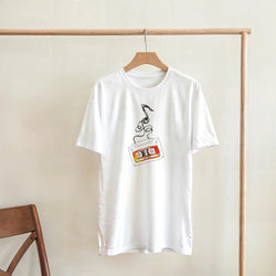 White t-shirt featuring a colorful vintage cassette tape graphic with unspooled black tape, perfect for retro music aesthetic streetwear.