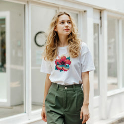 Cute hibiscus T-shirt for women with tropical floral print, retro aesthetic summer top.