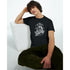 Male model wearing Gothic Glory graphic T-shirt in black cotton with a silver-toned design.
