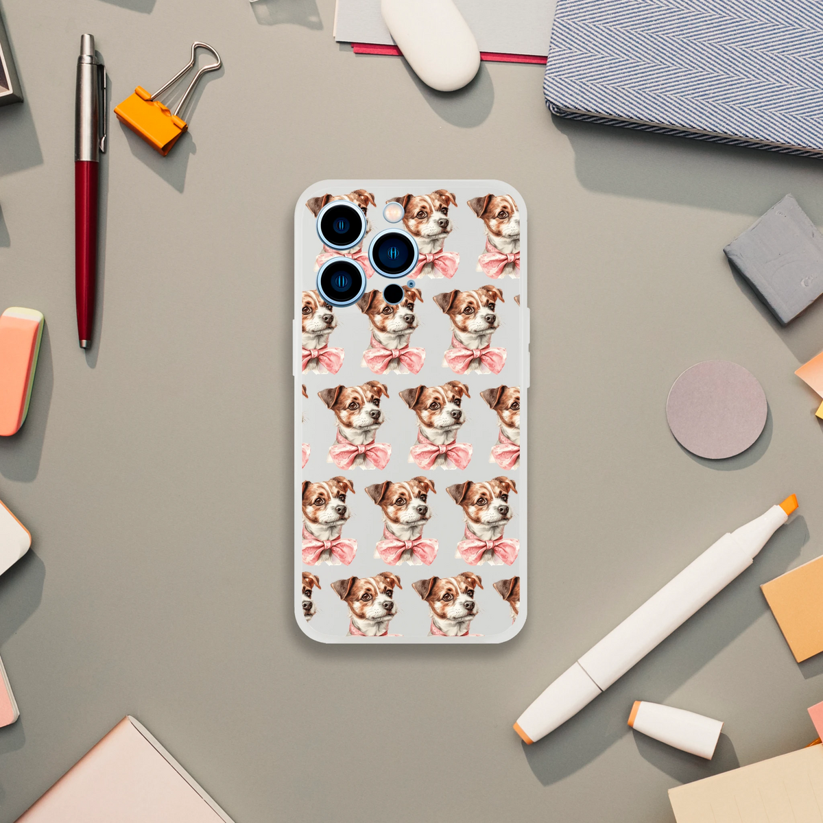 Slim transparent iPhone case for 13-16 with a repeating pattern of cute dog faces wearing pink bows.