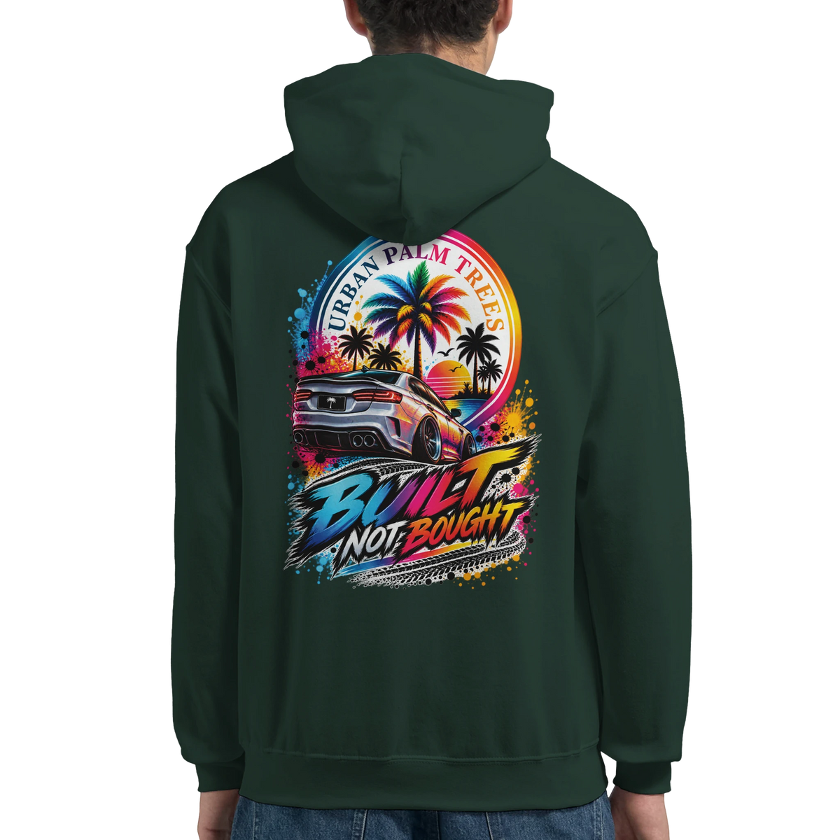 Back of dark green hoodie featuring "Built Not Bought" graphic with modified car, palm trees, and colorful sunset design.