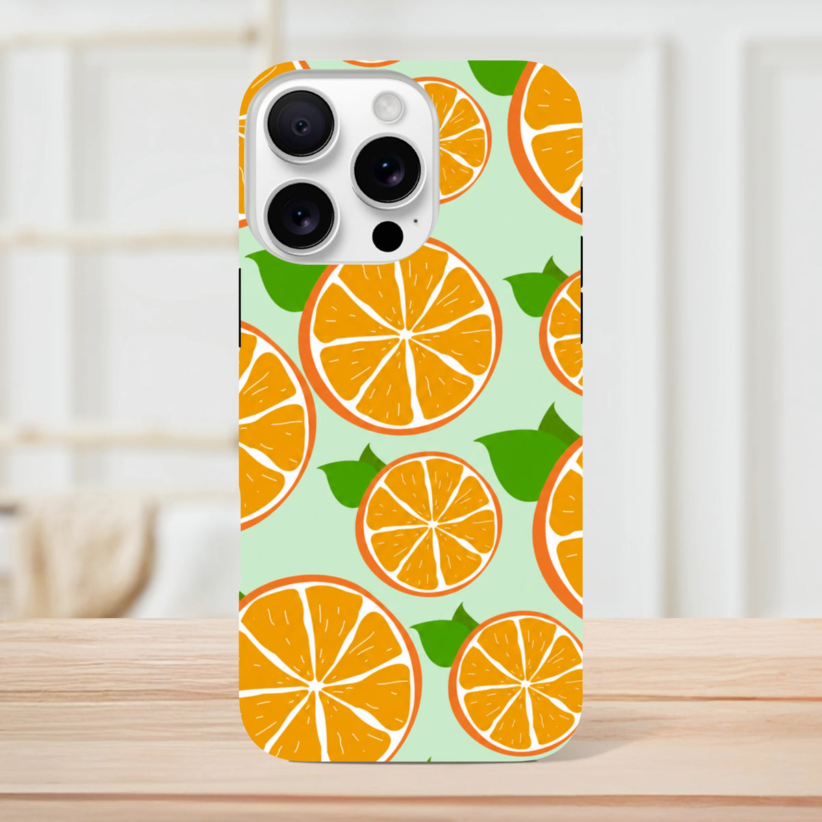 Tough iPhone case with bright orange slice pattern on mint green background. Citrus PatPhone cover for drop-proof protection.