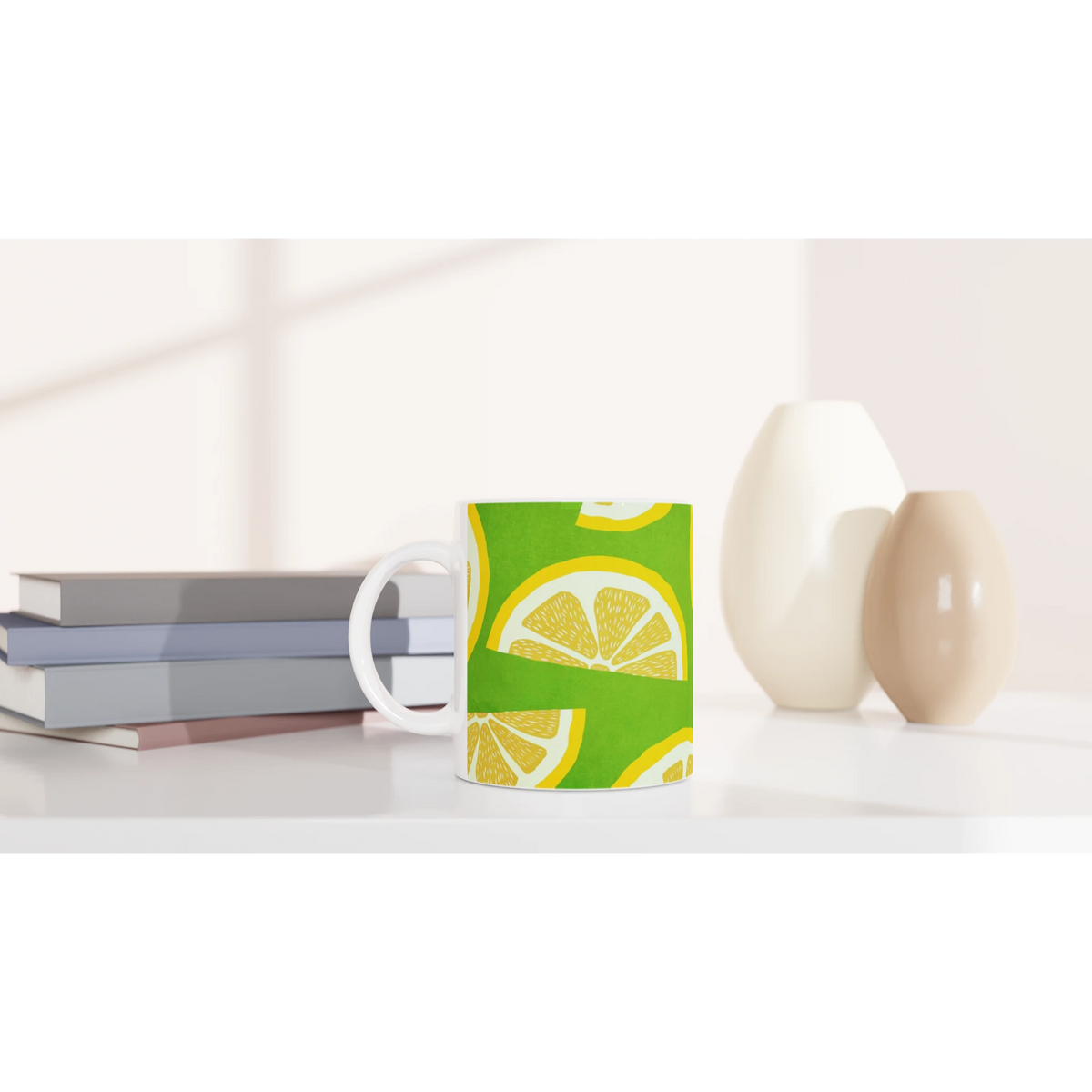 Cute Lemon Slice Mug with citrus print, a white ceramic coffee cup on a desk beside notebooks.