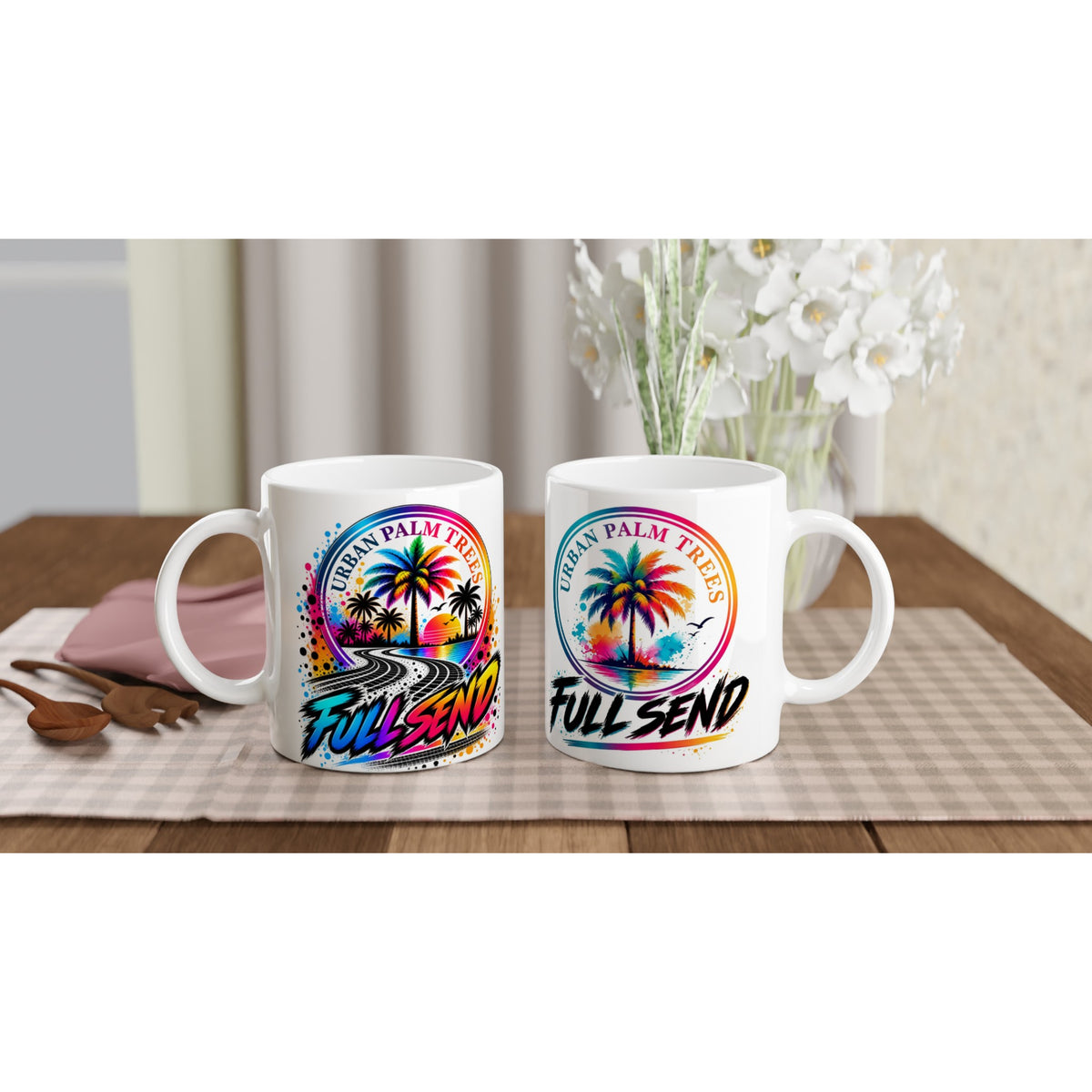 Two white Full Send Petrolhead mugs featuring colorful Urban Palm Trees graphics and tire track art on a wooden table.