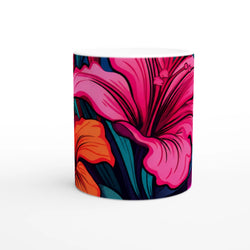 Colorful tropical hibiscus mug with pink, orange, and blue floral design for coffee or tea.