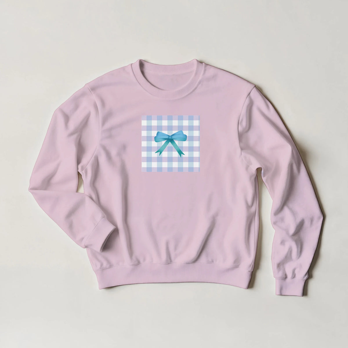 Lavender sweatshirt featuring a blue gingham square graphic with a teal bow for a cute coquette aesthetic pullover.