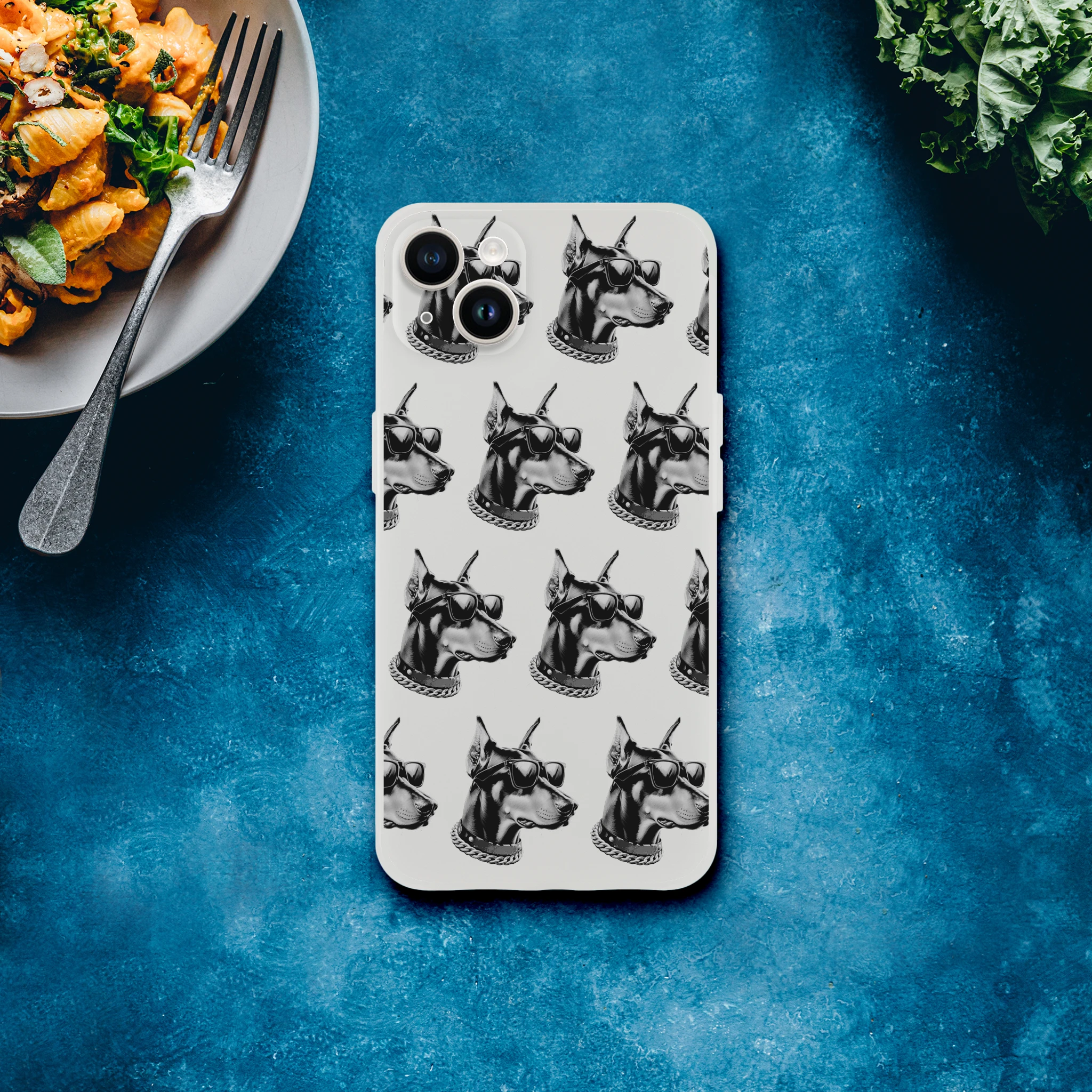 Clear iPhone case featuring a repeating gangster dog head pattern with sunglasses and a chain for iPhone 13-16.
