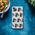 Clear iPhone case featuring a repeating gangster dog head pattern with sunglasses and a chain for iPhone 13-16.