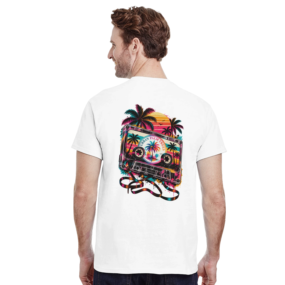 Back view of white t-shirt featuring retro cassette tape graphic with palm trees and colorful sunset on the rear.