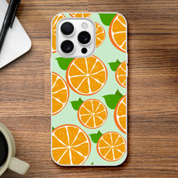 Orange citrus-pattern iPhone case on mint backdrop with frosted matte finish and slim design.