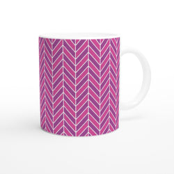 Pink herringbone ceramic mug featuring a bold retro geometric chevron pattern in shades of pink and purple with a smooth white handle.