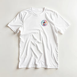 White crew neck t-shirt featuring a colorful retro Urban Palm Trees circular graphic print on the left chest.