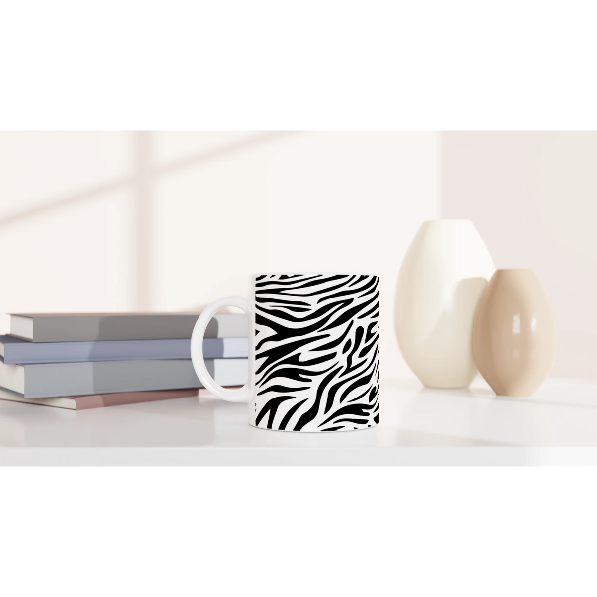 Bold black-and-white zebra print mug for coffee or tea on a desk.