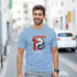 Man wearing light blue Japanese graphic T-shirt with red JAPAN text and koi design, soft cotton blend.