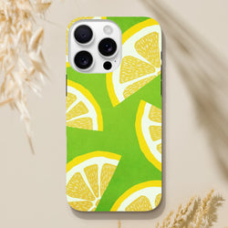 Green iPhone case featuring a bold yellow lemon slice pattern. A shock-absorbing citrus fruit phone cover built for durability.