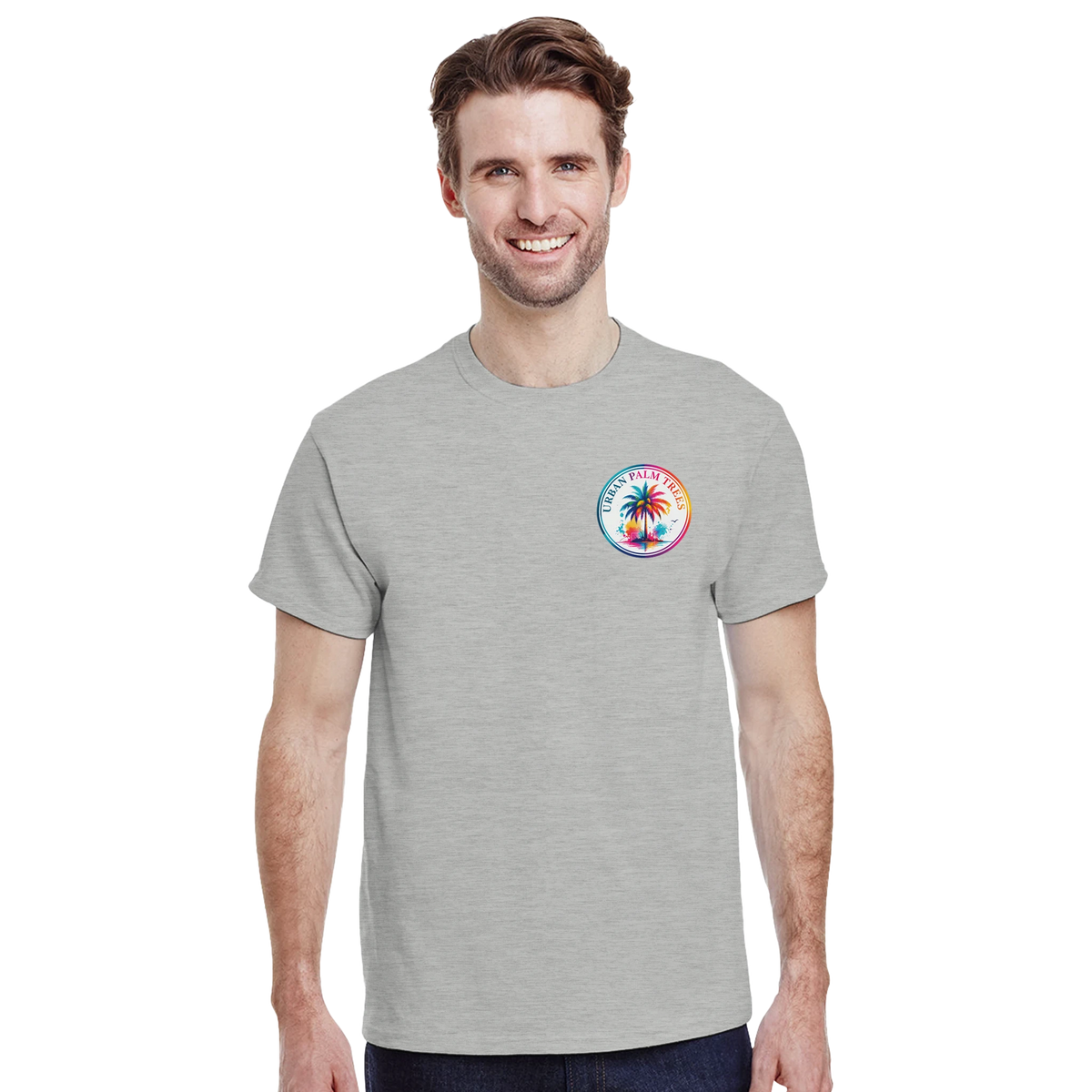 Man wearing grey crew neck t-shirt with colorful circular Urban Palm Trees logo on the left chest.