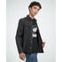 Male model wearing a black mental health graphic T-shirt under a dark washed denim shirt.