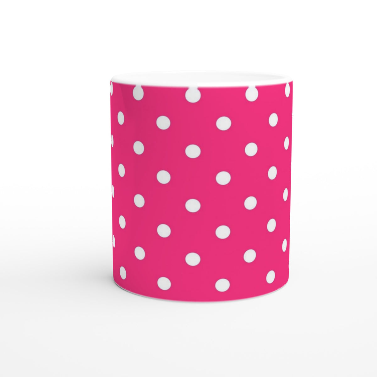 Hot pink ceramic coffee mug with white polka dots, featuring a retro spotty design for daily tea or coffee.