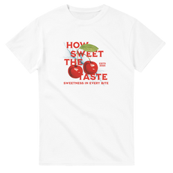 Retro white t-shirt featuring bold red cherries and the phrase "How Sweet The Taste" in vintage typography.