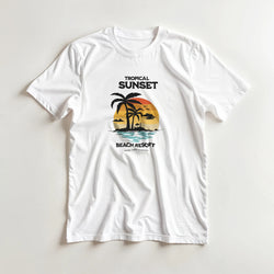 White t-shirt with retro tropical sunset graphic featuring palm trees and "Tropical Sunset Beach Resort" text.