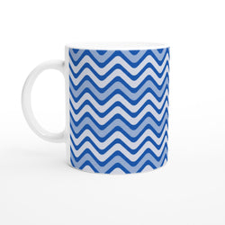Blue wavy stripe ceramic mug featuring a retro geometric pattern. 11oz coffee cup with a white handle.