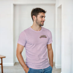 Man wearing a light purple crew-neck t-shirt with a small retro "Urban Palm Trees" logo on the chest, styled with blue jeans.