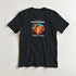 Black women's graphic T-shirt with sunset beach scene, palm trees, and California Beach Paradise lettering.