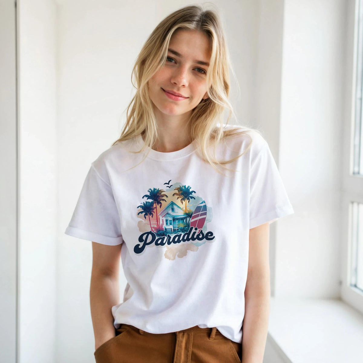 Woman wearing Retro Paradise T-shirt for Women with palm trees and tropical house print.