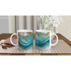 Set of three blue and gold agate mugs with luxury marble-effect ceramic design on a table