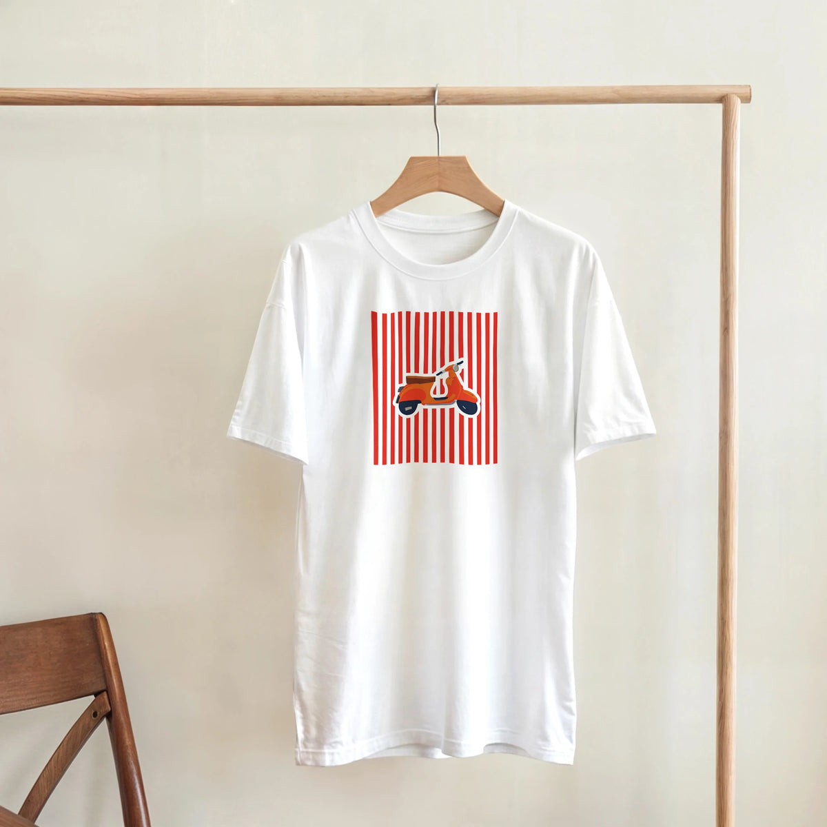 White vintage mod streetwear t-shirt featuring a retro orange scooter graphic on red vertical stripes.