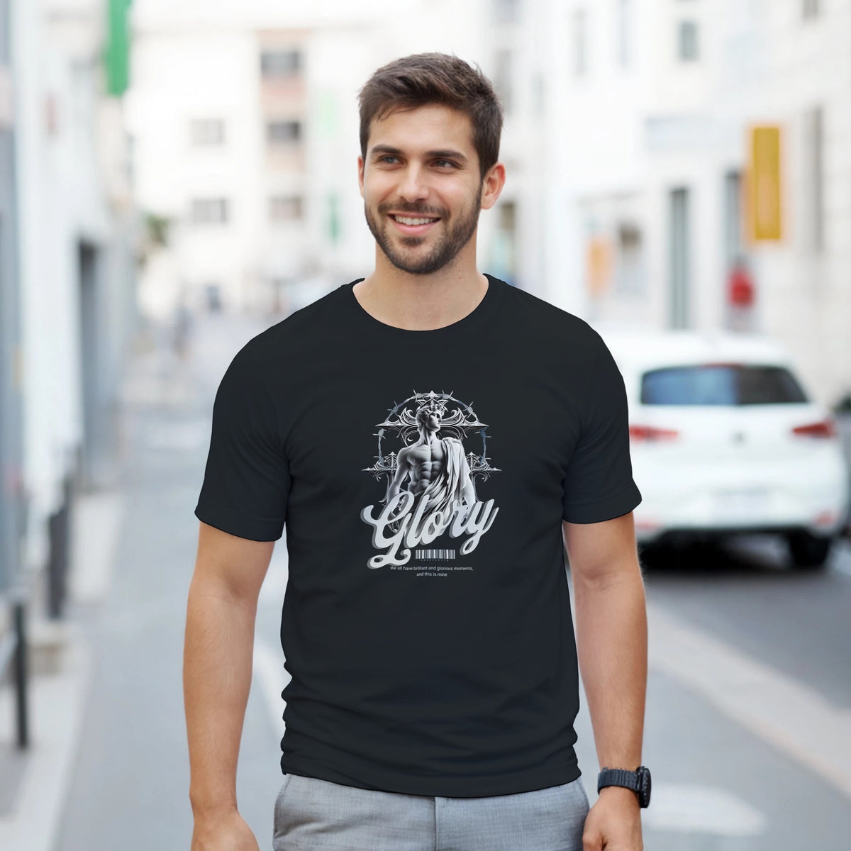 Gothic Glory men's graphic T-shirt in black with grayscale statue and 'Glory' script on urban street.
