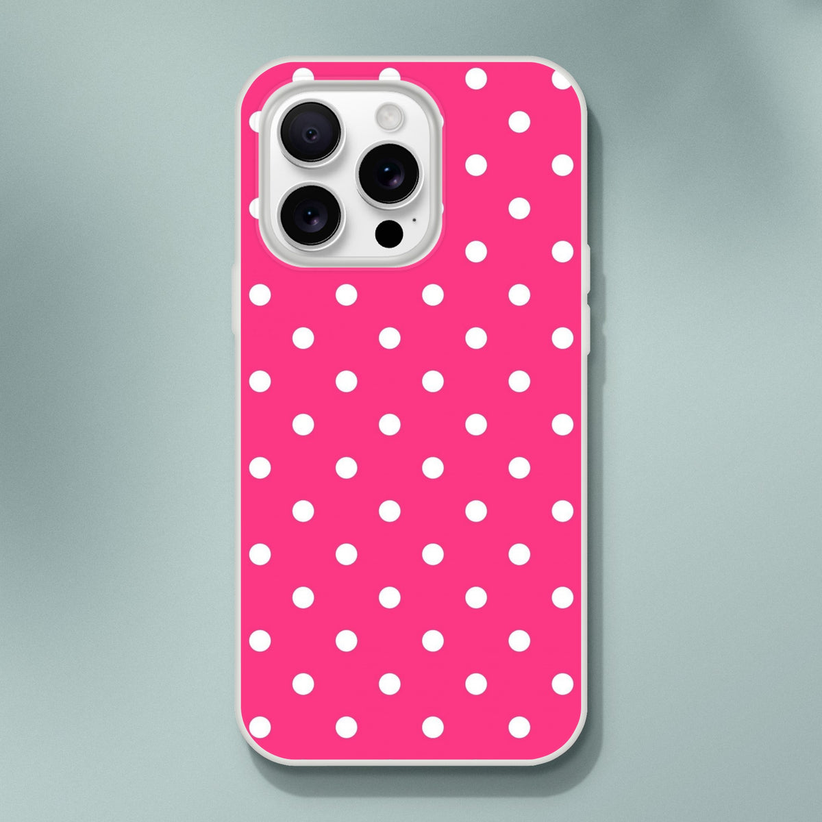Hot pink and white polka dot retro iPhone case with matte finish and white bumper for models 13-16.