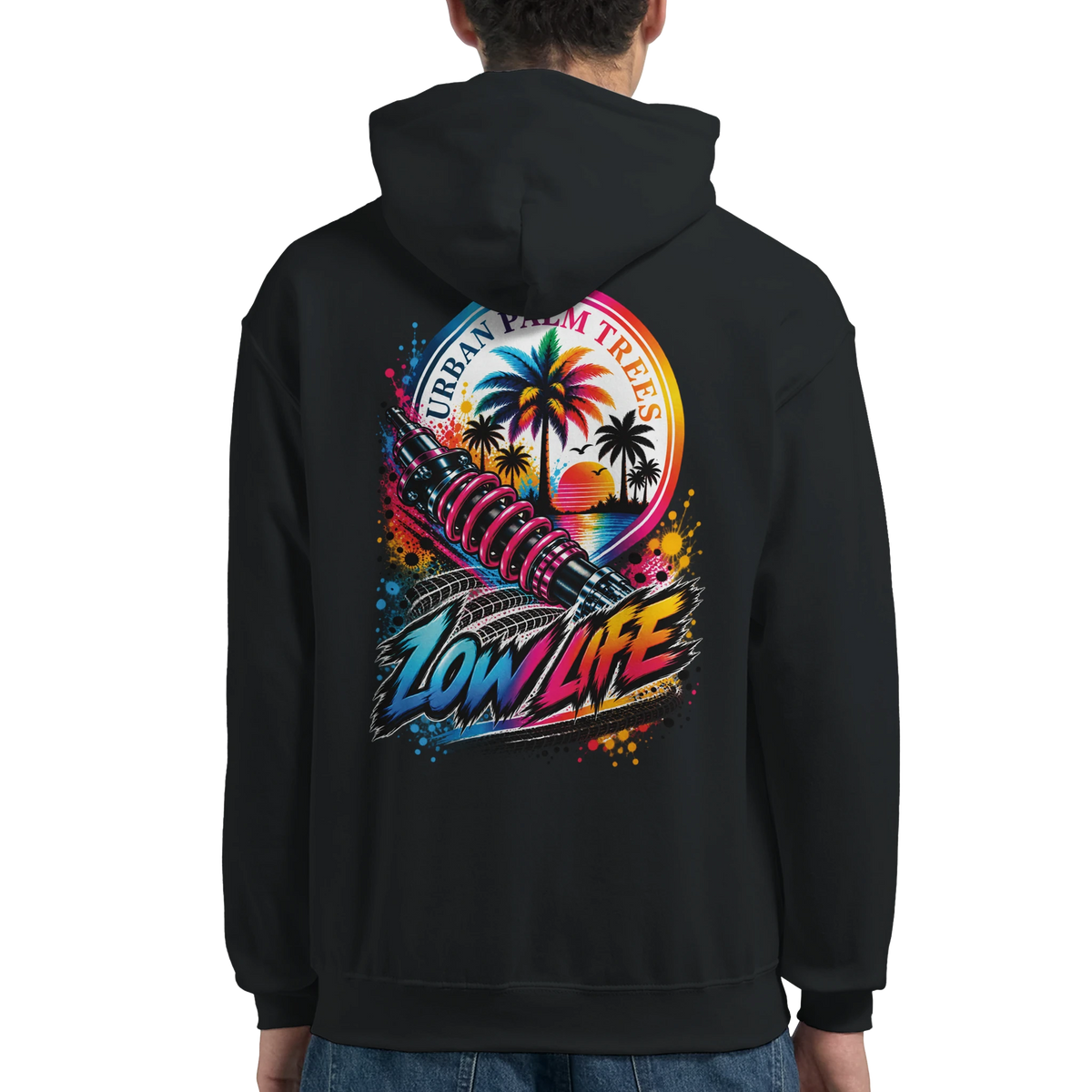 Black hoodie back featuring "Low Life" graphic with pink coilover shock, palm trees, sunset, and tire tracks.