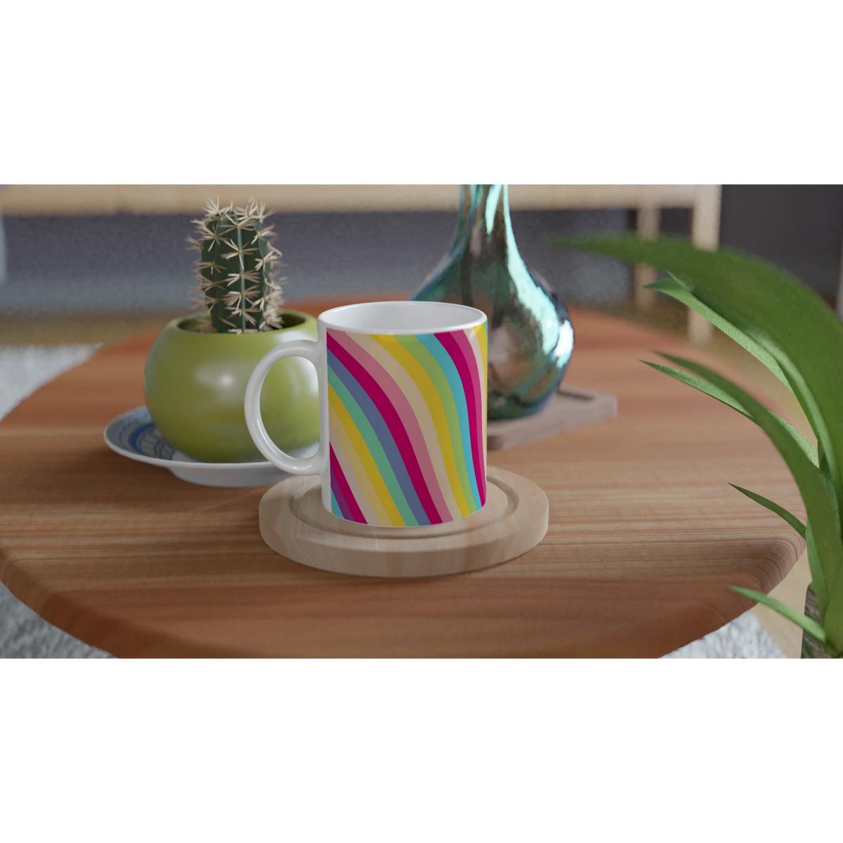 Retro rainbow-striped ceramic mug on a wooden table with a small cactus nearby.