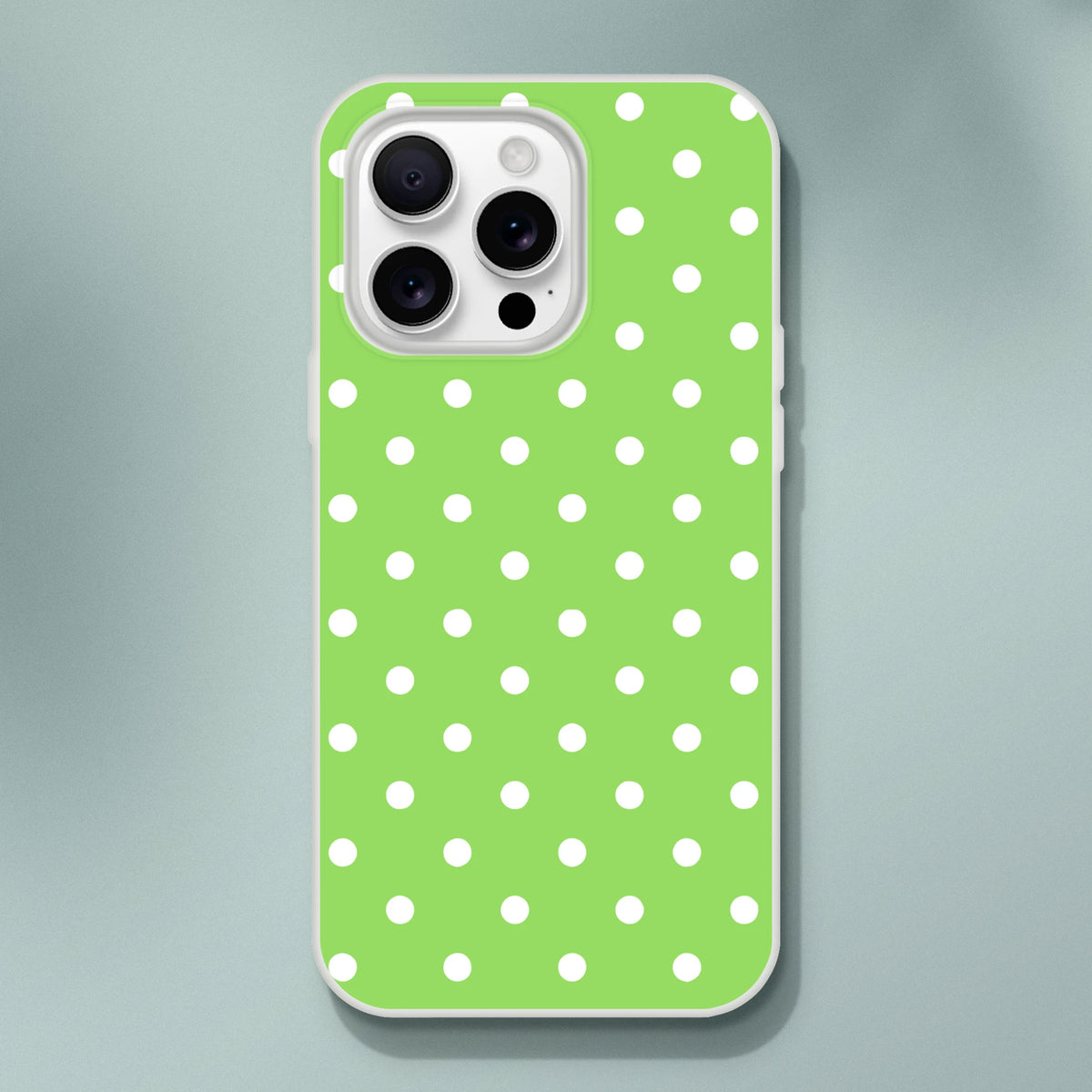 Retro green phone case with white polka dots. Shock-absorbing TPU cover for iPhone 13-16 with smooth matte finish.